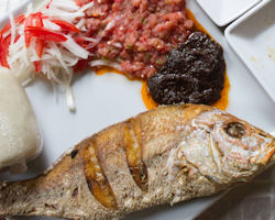 Kenkey served with fried fish and shitor